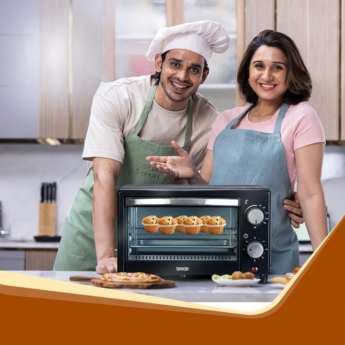 Happy couple baking in the kitchen with Tanish 12L OTG oven, showcasing practical family use