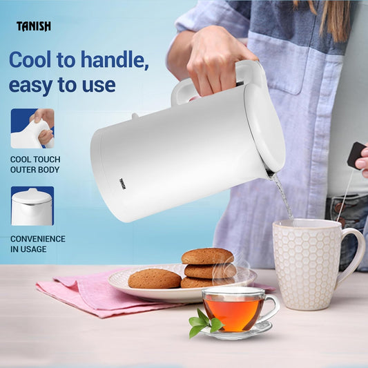 Tanish white electric kettle being used to pour hot water for tea with ergonomic handle